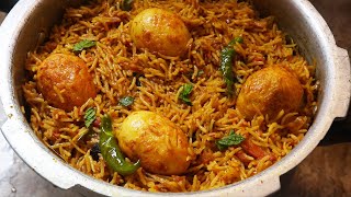 Egg biryani in pressure cookerBachelors Recipe Quick Egg Biryani [upl. by Sirovart114]