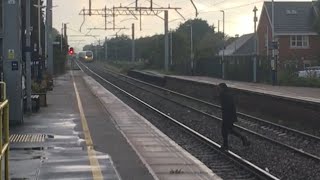 Person JUMPS ONTO RAILWAY TRACKS in front of 390 046 [upl. by Atinoj]